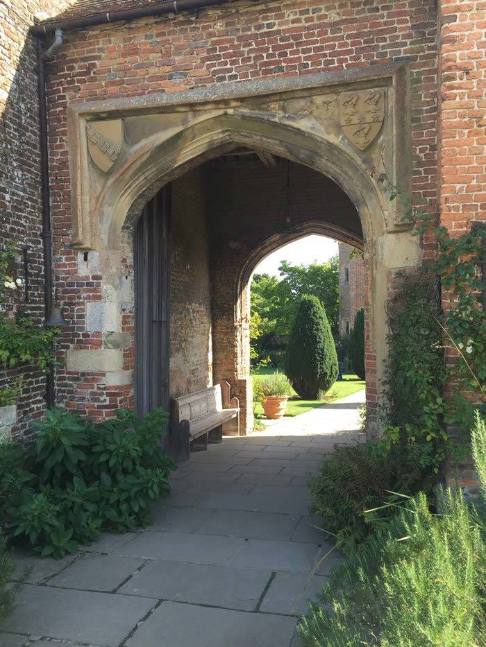 Yew tree entrance to Sissinghurst Gardens, with Lavender hedging