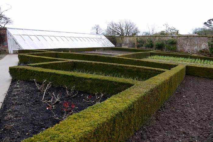 Composting and mulching the winter garden to prepare the soil for spring planting